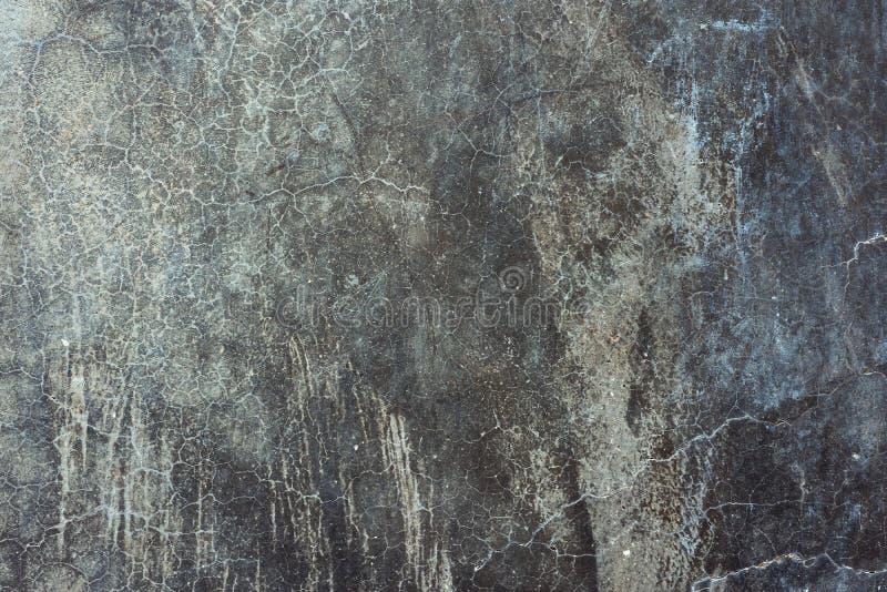 Old distressed scratched cement concrete wall background with grungy texture. Gradient black gray blueish colors and shades royalty free stock images