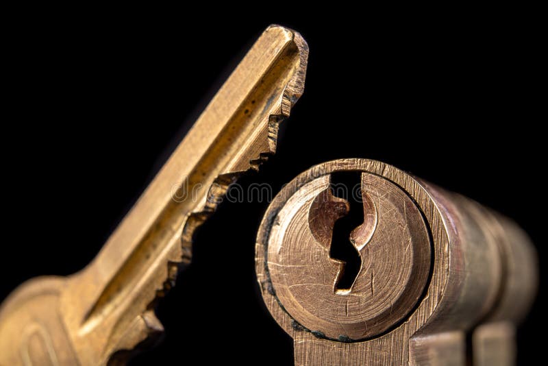 A old door lock on a dark background. A patent and keys to secure the front door royalty free stock images