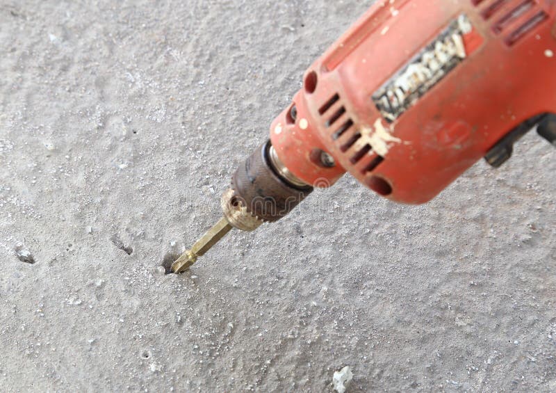 Old drill with concrete stock image. Image of handyman 42554085
