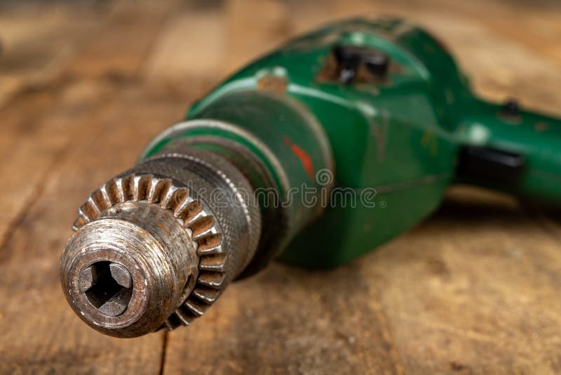 Old Drills on a Wooden Table. Rusty Drill Holder in an Old