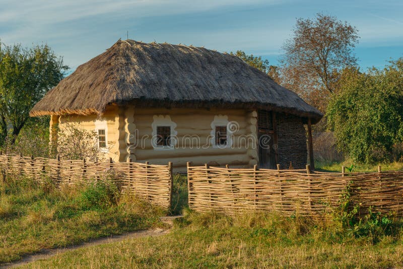 Old rural house with wattle fence in village royalty free stock image Old rural house with wattle fence in village royalty free stock image