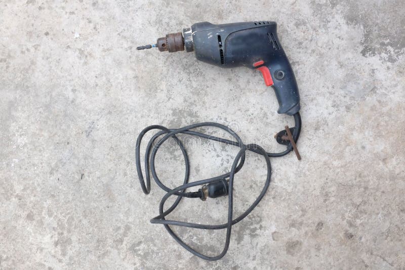 Old Electric Drill with on on Cement Floor . Stock Photo Image of