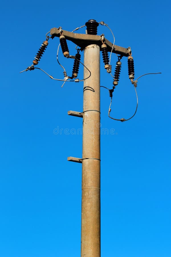 Old electric pole, abandoned power line with no wires
