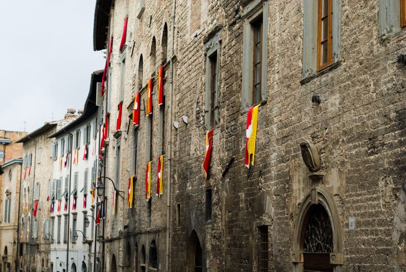 Old facade with the flags of t