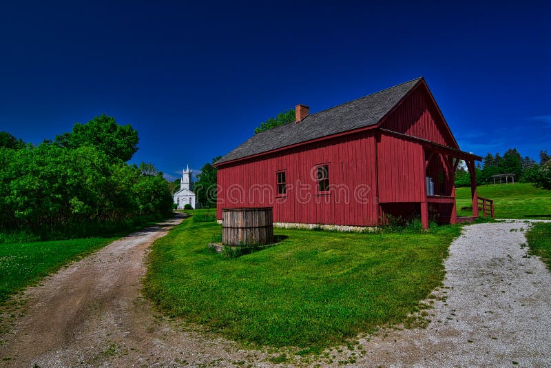 Old barn and church along a dirt road at heritage hill state historic park near Allouez WI