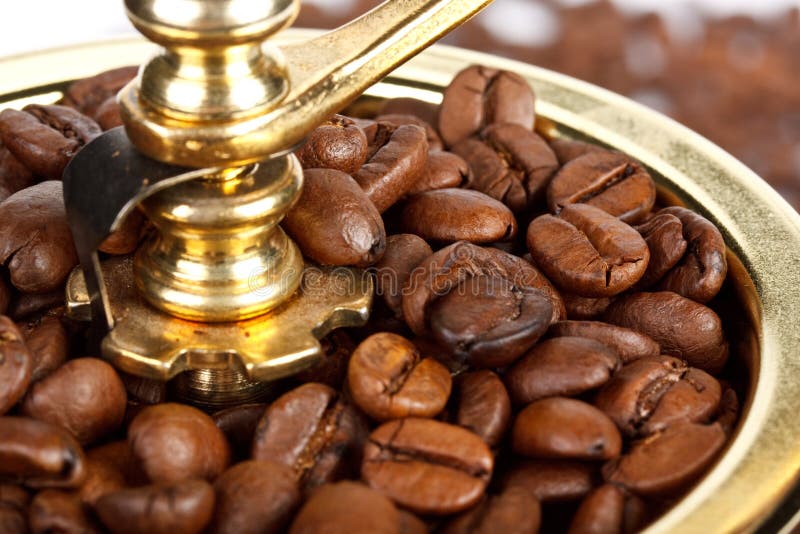 Old-fashioned coffee grinder and coffee beans