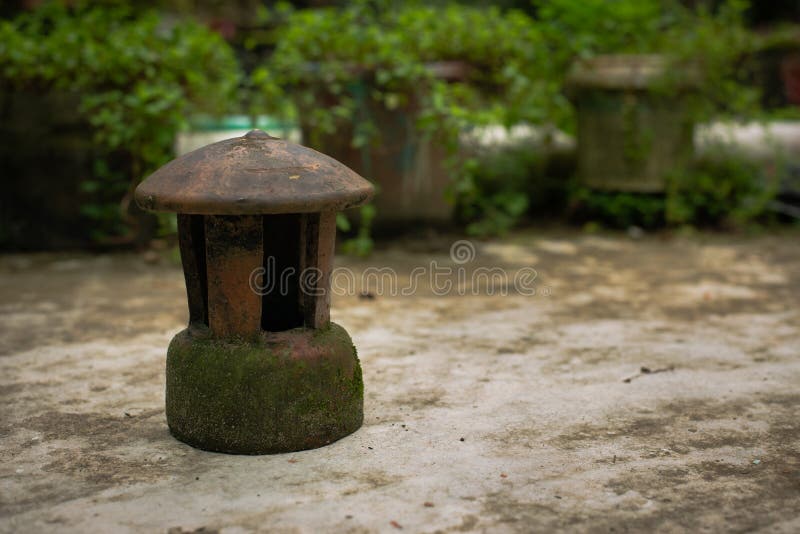 Old fashioned lantern, green garden tub stock photography