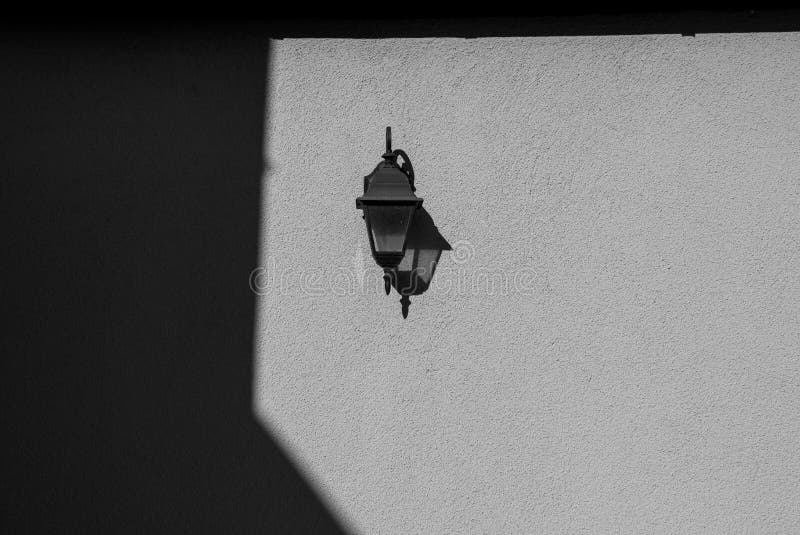 Old fashioned lantern mounted on wall royalty free stock images
