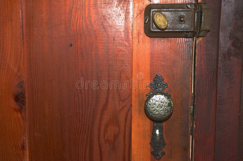 An Old Fashioned Lock, Door Handle and Dead Bolt on a Wooden Door ...