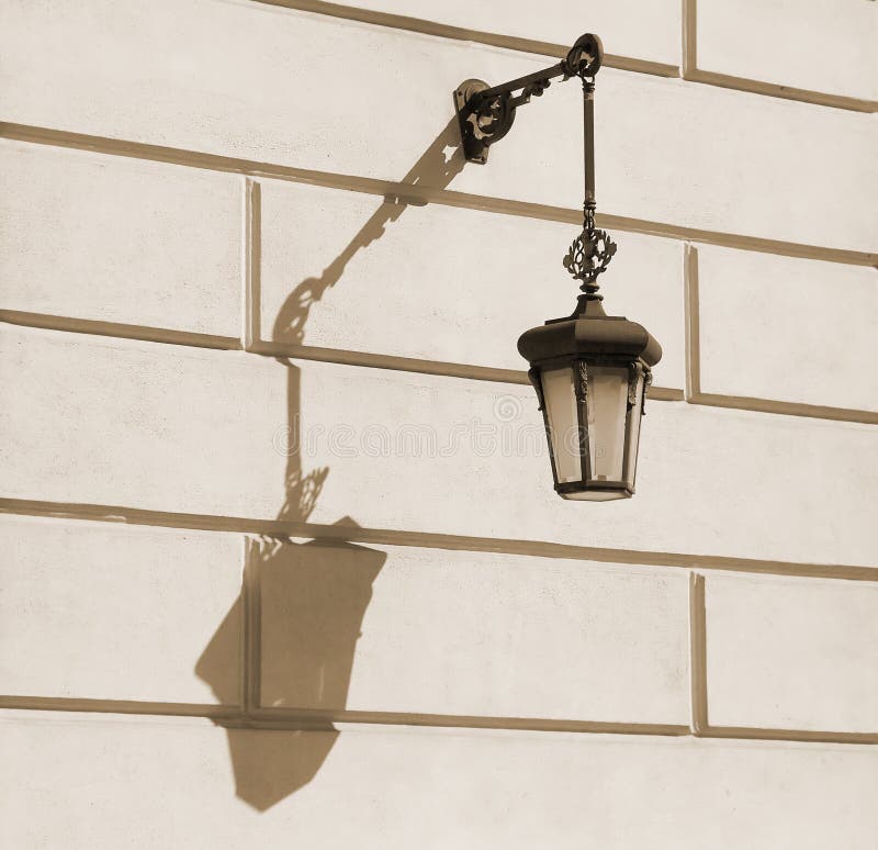 Old-fashioned street lamp with shadow