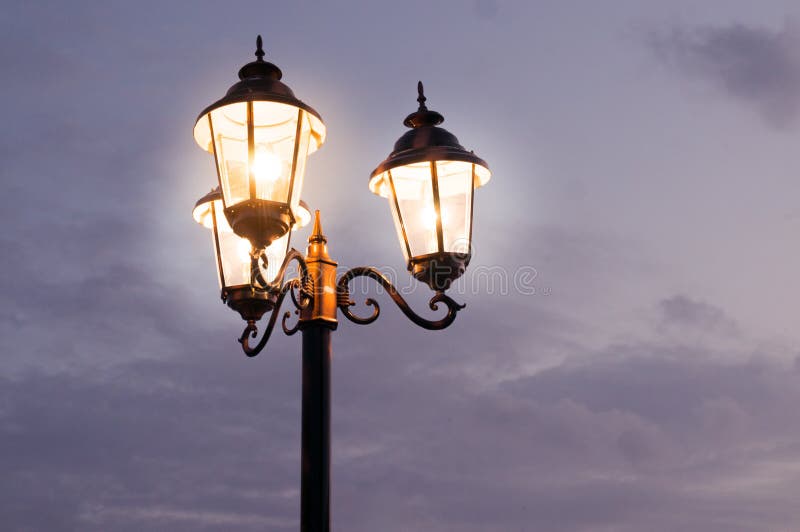 Old Fashioned Street Lights Shot Against a Cloudy Sky Stock Image ...