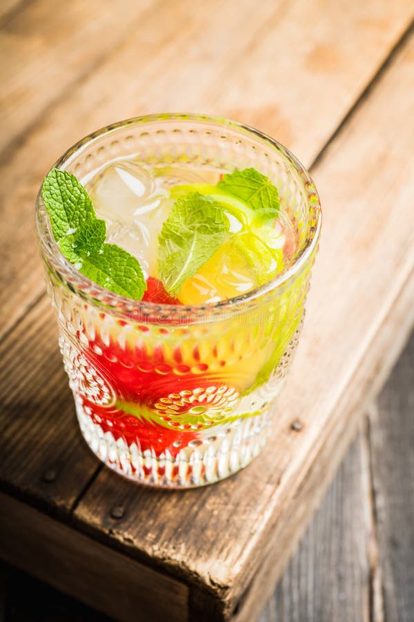 Old Fashioned Summer Cocktail Based on Gin with Raspberry and Lime on