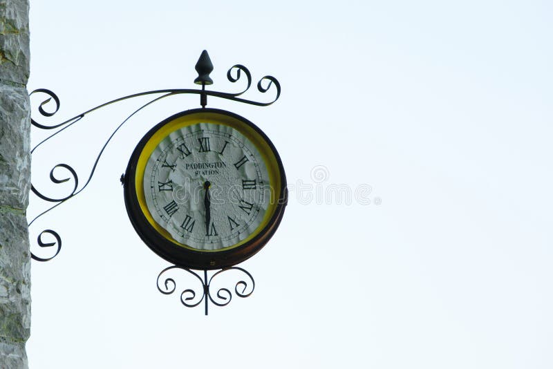 Old Fashioned Wall Clock with `Paddington Station` Text Inside Stock