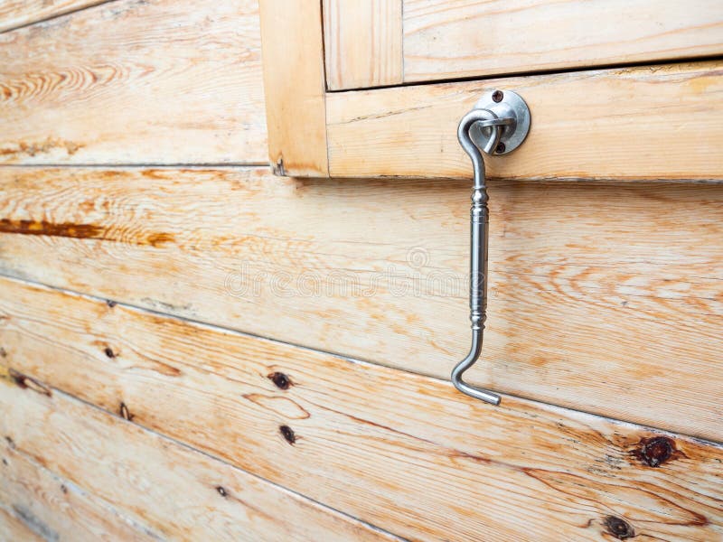 Oldfashioned Window Latch Hook Hanging On Wood Wall Background Stock Image Image of lock