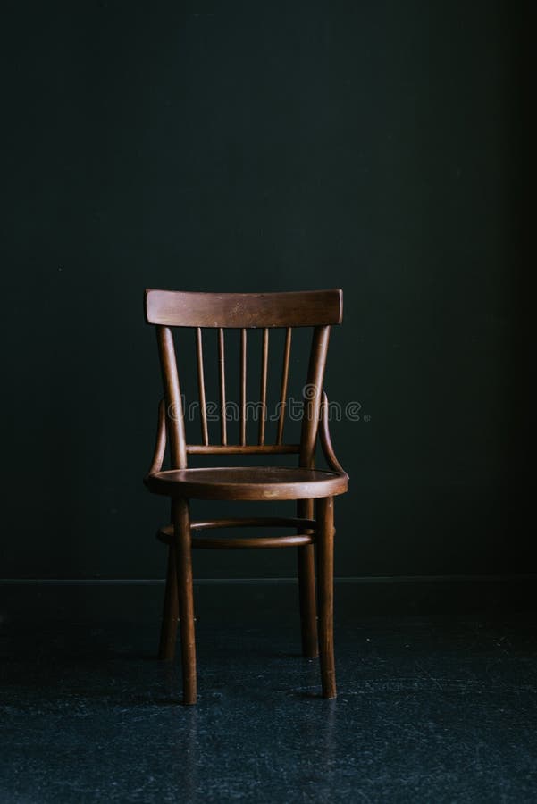 Old-fashioned Wooden Chair on a Dark Background in the Interior Stock Photo  - Image of color, armchair: 154135658