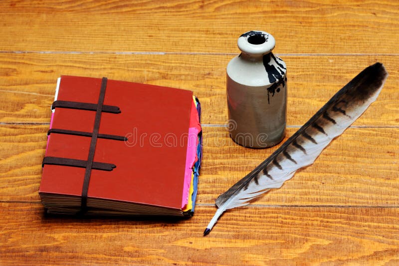 Old Fashioned Writing Equipment with Ink Pen and Parchment Paper Scroll