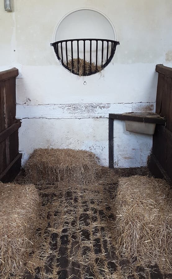 Old fasioned ancient stables with hay