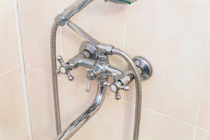 Old faucet the faucet Assembly in the bathroom. Limescale on chrome taps and mixer shower stock images