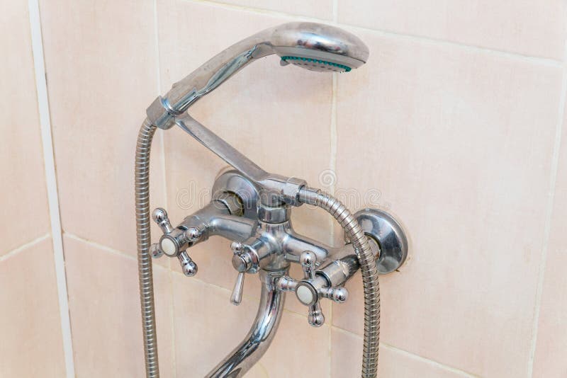 Old faucet the faucet Assembly in the bathroom. Limescale on chrome taps and mixer shower royalty free stock photo