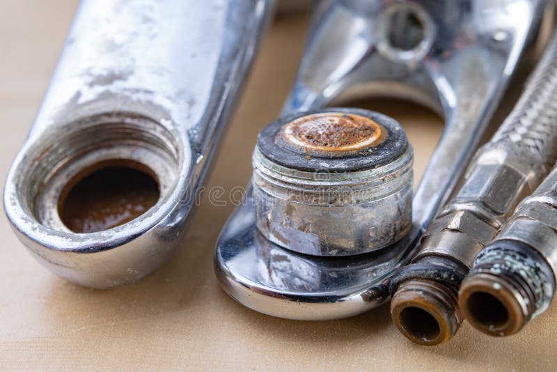 Old faucet for repair. Used hydraulic parts. Light background stock photos Old faucet for repair. Used hydraulic parts. Light background stock photos