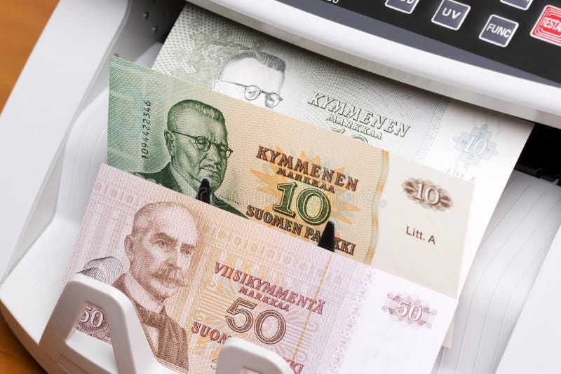 Old Finnish Marks in the counting machine stock image