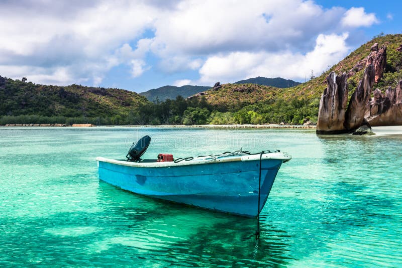 Old Fishing Boat On Tropical Beach At Curieuse Island 