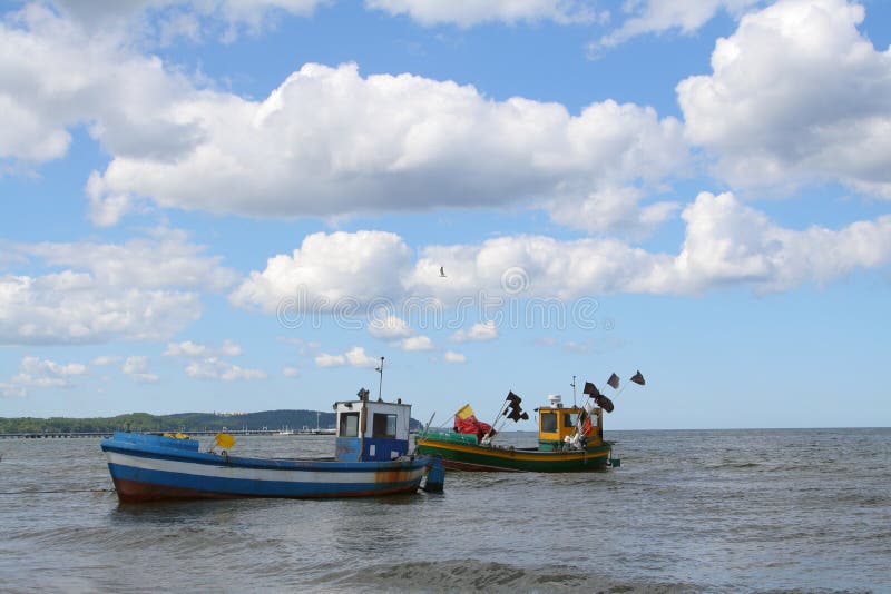 Old fishing boats against beautiful sky