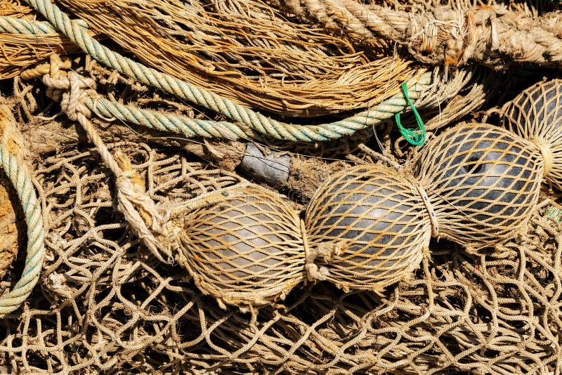 Old Fishing Nets with Ropes and Floats - Full Frame Stock Image
