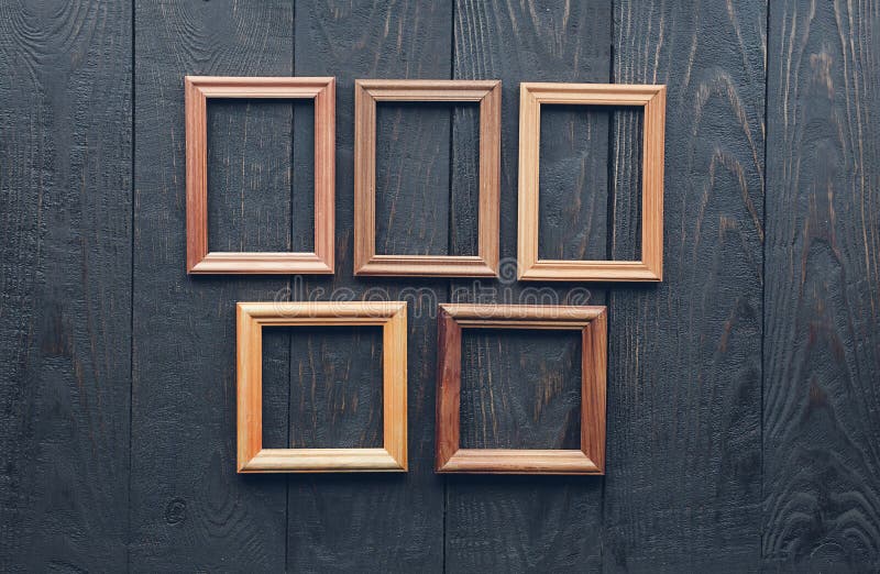 Old frames on wooden wall stock photo. Image of grunge 173818858