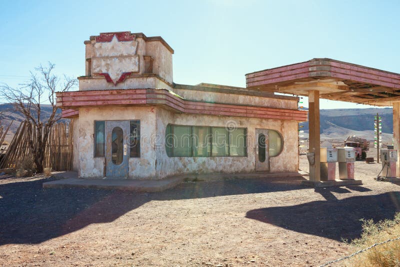 Old gas station in Sahara desert  near Ouarzazate, Morocco. Toned image