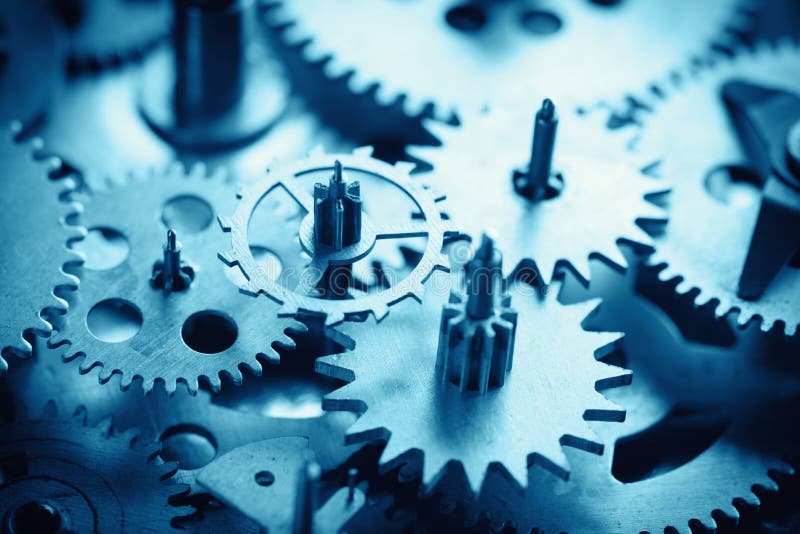 Old gears and cogs macro blue toned stock photo