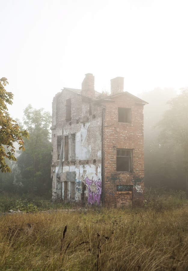 Old ghost house in a fog stock image Old ghost house in a fog stock image
