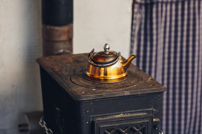 Old Gilded Kettle on an Iron Stove Stock Image Image of colorful