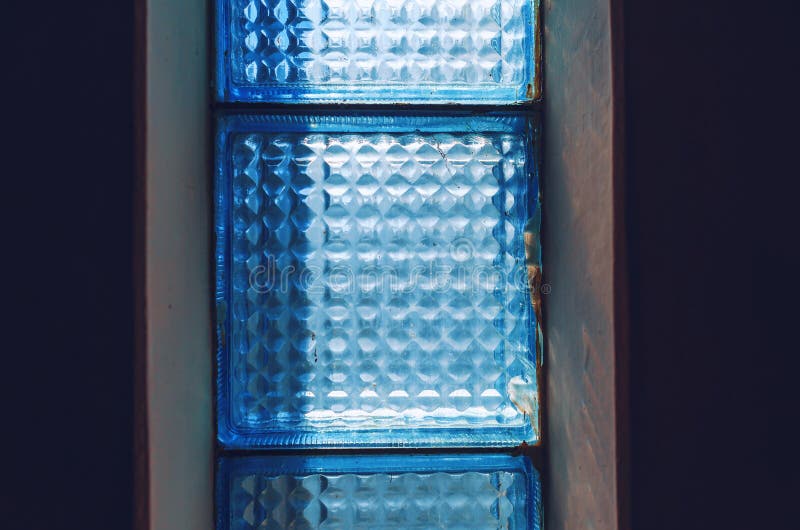 Old Glass Wall Blocks in the Wall of a Sovietstyle House. Scattered