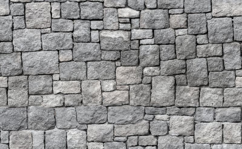 Old gray stone wall, seamless background texture