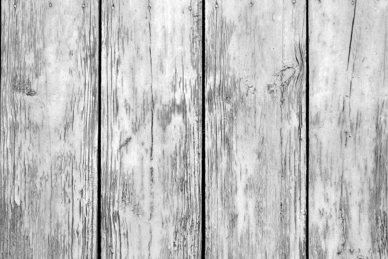 Old grunge wooden fence pattern in black and white. Abstract background and texture for design.