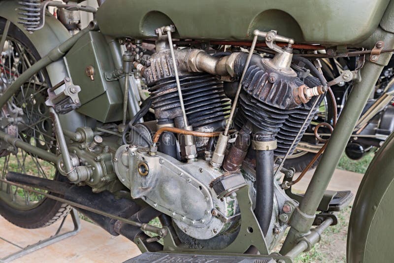 Detail of an ancient military motorcycles Harley Davidson 1000 J (1918) - old V twin engine with uncovered pushrods and rocker arms exposed at motorcycle show of Motoclub i Bradipi during the festival A tutta festa on July 7, 2013 in Fognano, RA, Italy. Detail of an ancient military motorcycles Harley Davidson 1000 J (1918) - old V twin engine with uncovered pushrods and rocker arms exposed at motorcycle show of Motoclub i Bradipi during the festival A tutta festa on July 7, 2013 in Fognano, RA, Italy