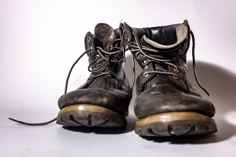 Old High Shoe Now Deformed, Brown-colored Boot Now Worn. Stock Photo ...