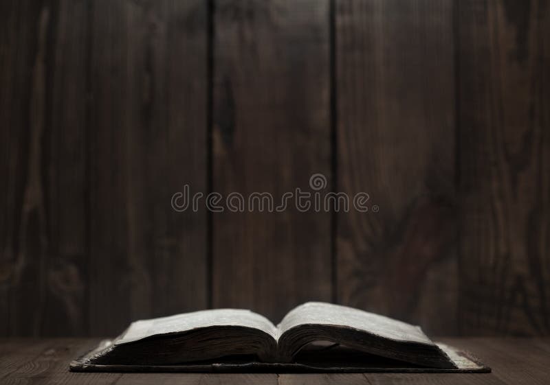 Old Holy Bible on wooden background stock photo Old Holy Bible on wooden background stock photo