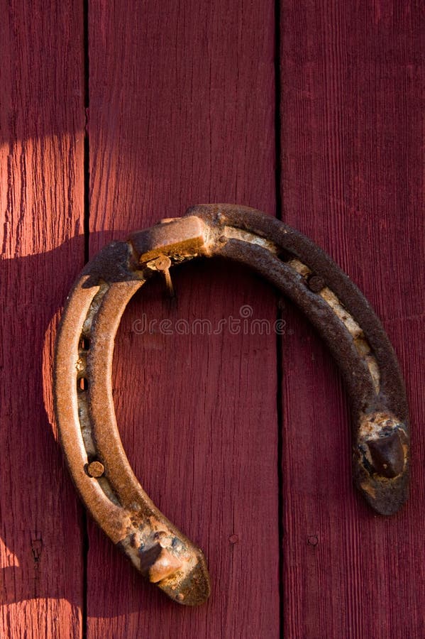 An Old Horseshoe on a Red Wall Stock Photo Image of antique, cowboy