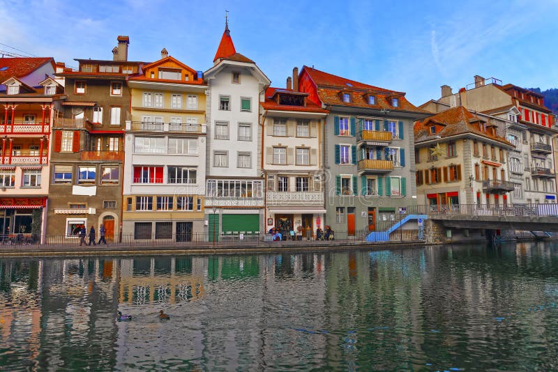 Old Houses on the Embankment in the Old Town of Thun in Switzerland. Thun is a city in Swiss canton of Bern. It is located where Aare river flows out of Lake Thun.