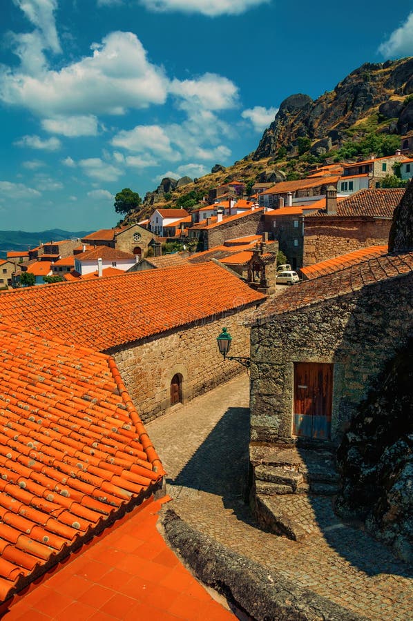 Old houses and medieval church with bell at Monsanto