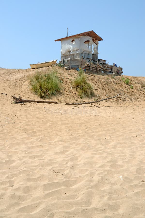 Old hut in deserted beach