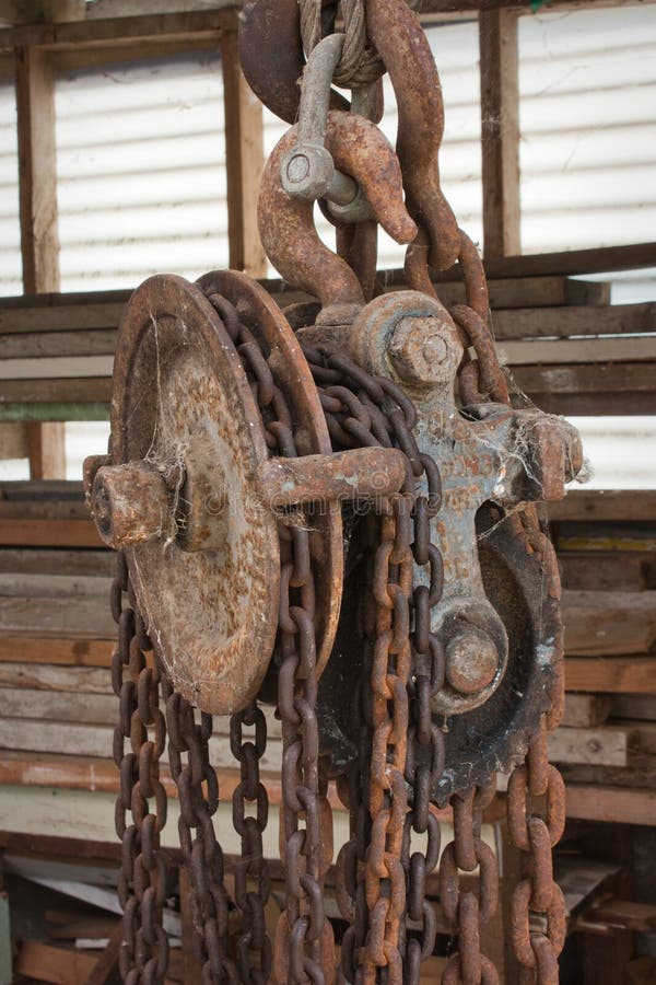 Old Winch with Rusty Gear Wheel and Corroded Steel Cable Coil Detail