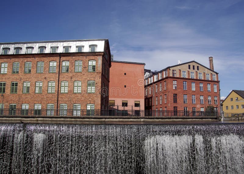 Old industry buildings at waterfall in Norrköping