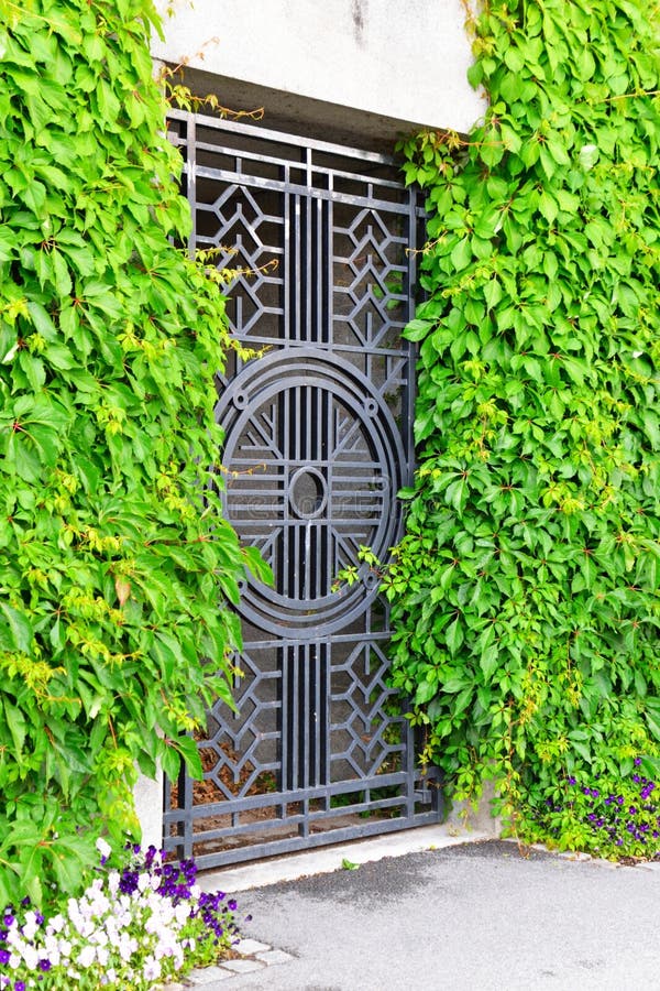 Old Iron Gate And Overgrown Plants Stock Photo Image of
