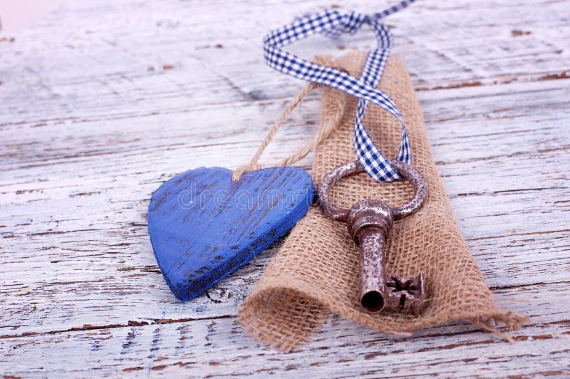 Old iron key with a heart