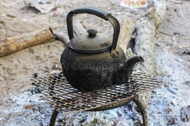 Old Kettle Boiling Water for Coffee or Tea in Countryside Stock Photo