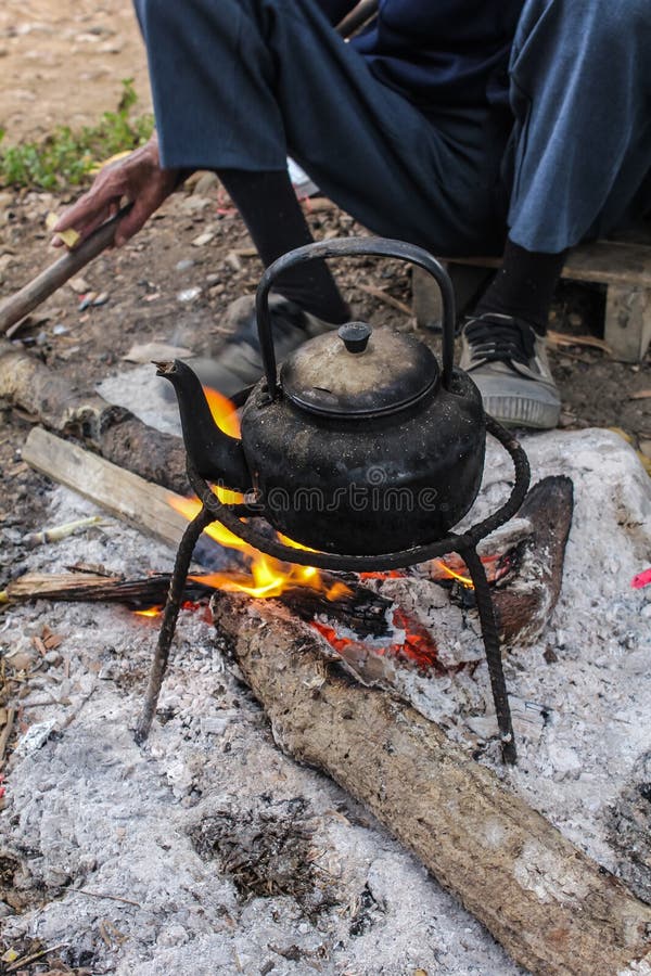 Old Kettle Boiling Water for Coffee or Tea in Countryside in Thai Stock