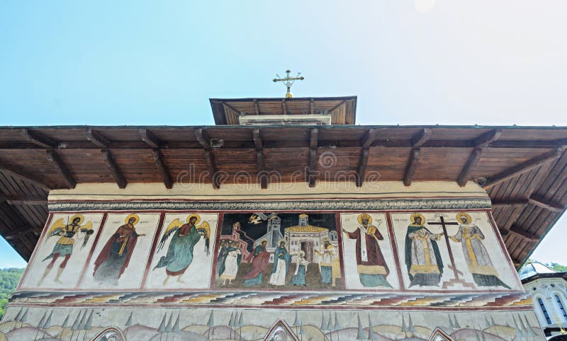 The old Lainici Monastery on a summer`s day, detail of the exterior painted wall stock photography The old Lainici Monastery on a summer`s day, detail of the exterior painted wall stock photography